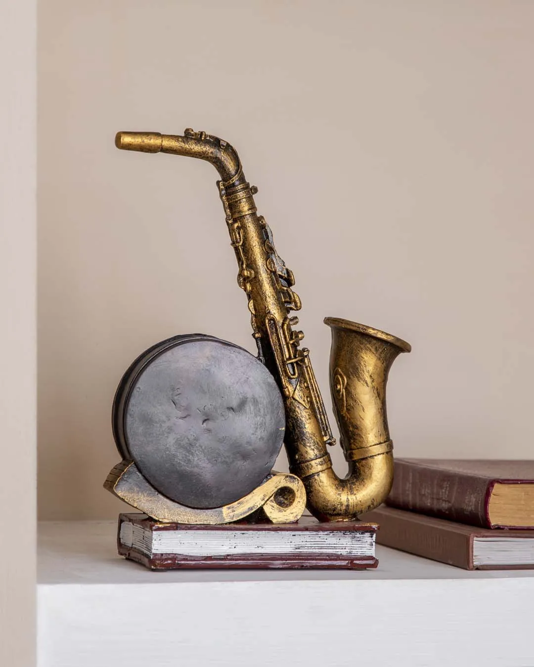 'Saxophone With Clock' Placed On Book Stand