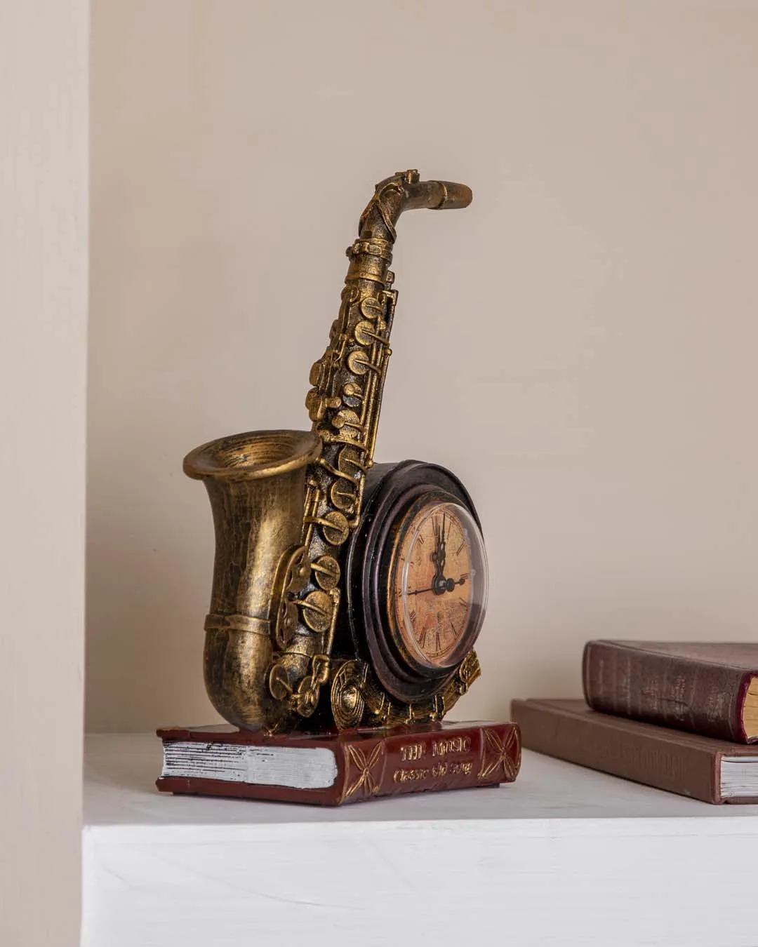 'Saxophone With Clock' Placed On Book Stand